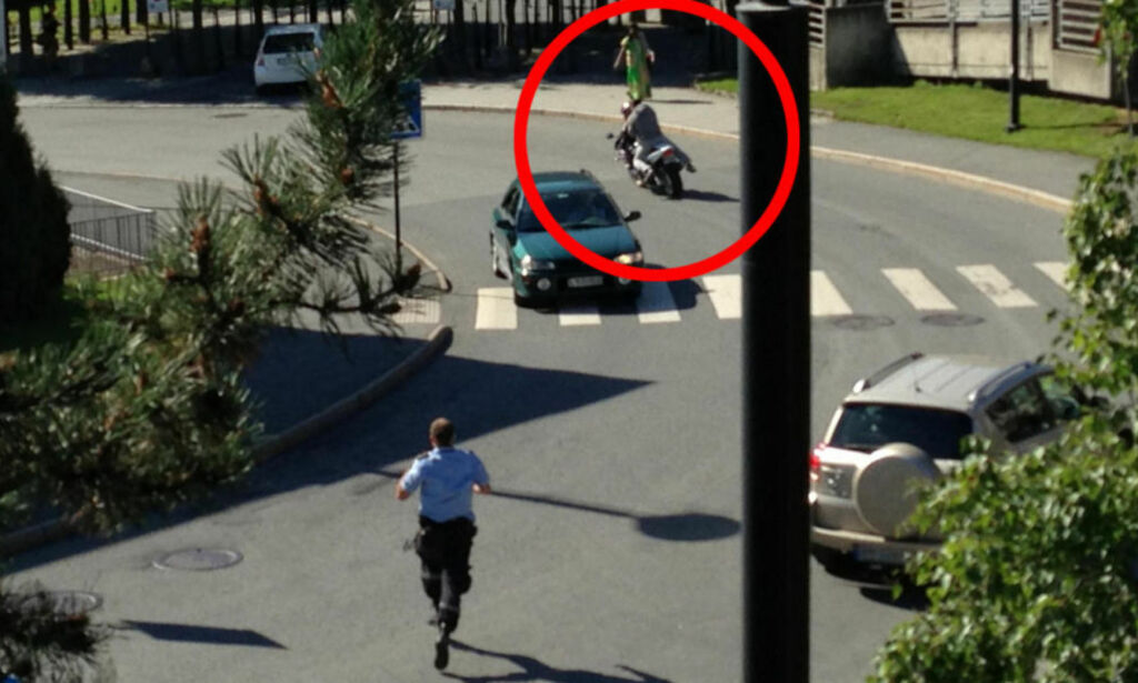 Her rømmer fangen i håndjern med politimann i hælene