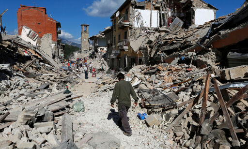 A man walks amidst rubble following an earthquake in Pescara del Tronto, central Italy, August 24, 2016. REUTERS/Remo Casilli TPX IMAGES OF THE DAY