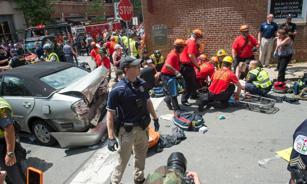 A woman is received first-aid after a car accident ran into a crowd of protesters in Charlottesville, VA on August 12, 2017.
A picturesque Virginia city braced Saturday for a flood of white nationalist demonstrators as well as counter-protesters, declaring a local emergency as law enforcement attempted to quell early violent clashes.
/ AFP PHOTO / PAUL J. RICHARDS
