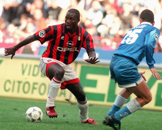 ** FILE ** Milan's forward George Weah, left, dribbles past Napoli defender Mirko Taccola during their Italian Serie A soccer match in Milan Sunday, Oct. 20, 1996. African soccer legend Weah is one of the leading candidates running in the Oct. 11 elections in Liberia, the West African country's first elections since civil war ended two-years ago. (AP Photo/Carlo Fumagalli)